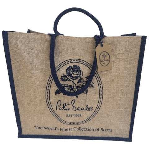 Beige jute tote bag with navy handles and Peter Deales rose crest logo