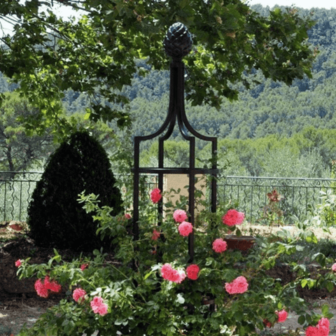 Black metal obelisk trellis with rounded finial and four side lattice frame
