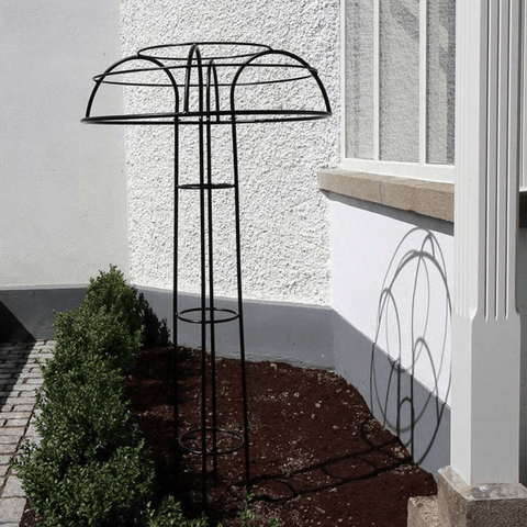Black umbrella support stand with curved top, vertical rods, and round base