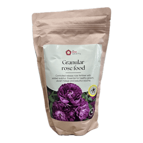 Kraft paper pouch of granular rose food for roses, labeled Rose Society